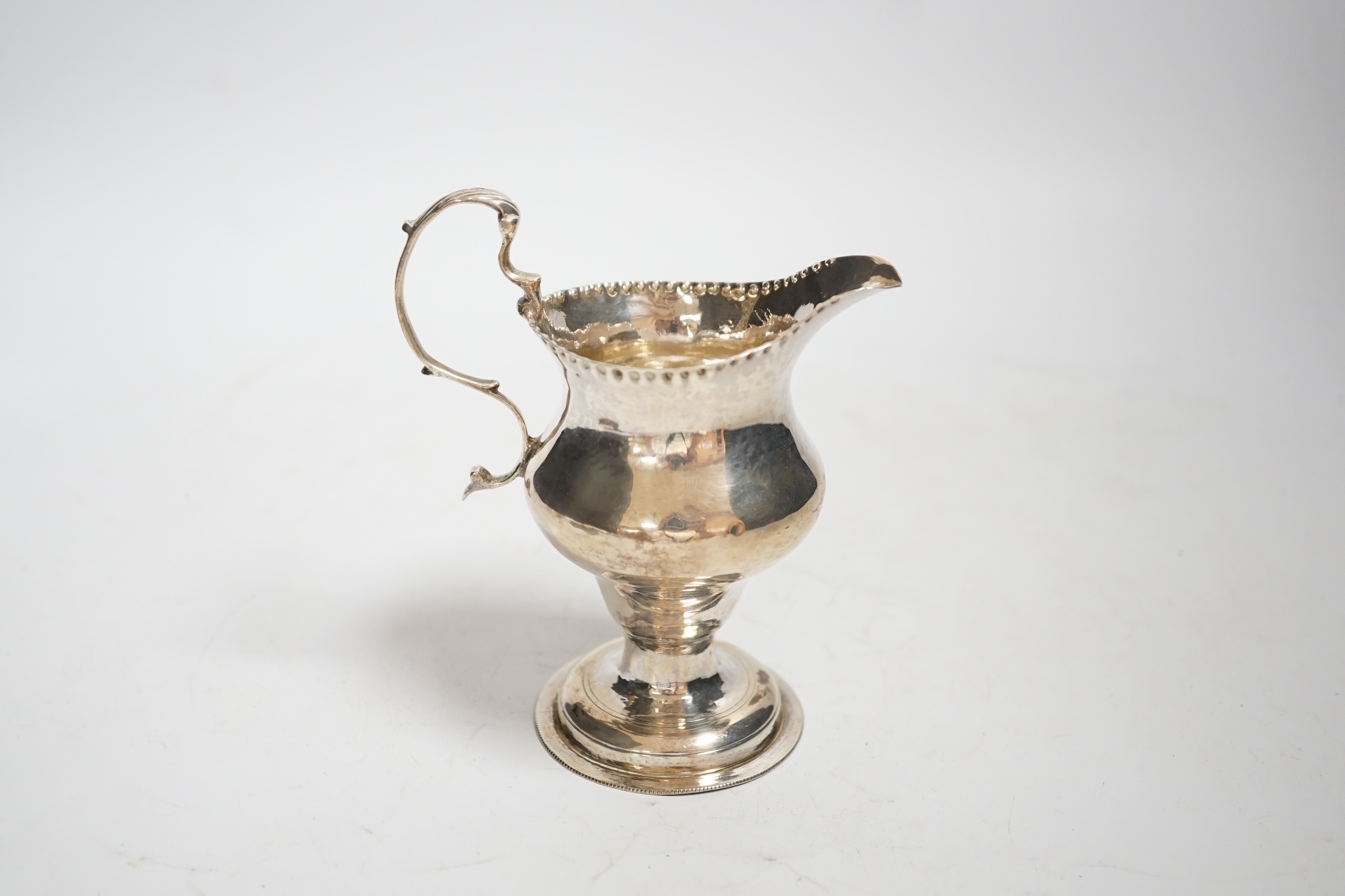 A George III silver inverted pear shaped cream jug, by Charles Hougham, London, 1780, 11.5cm, 2.4oz.